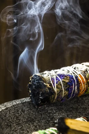 Smudge Ritual Burning Sage Stick. Spiritual Meditation and Yoga Ritual.